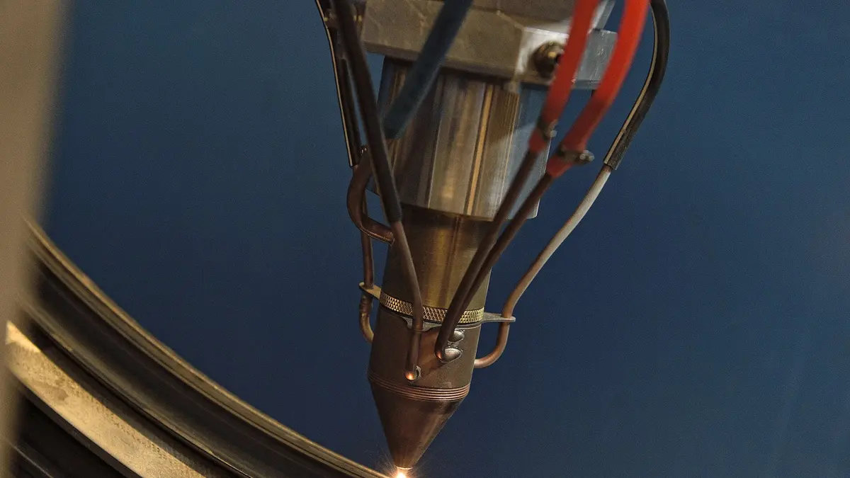 Macro of a metal additive-manufacturing head depositing material