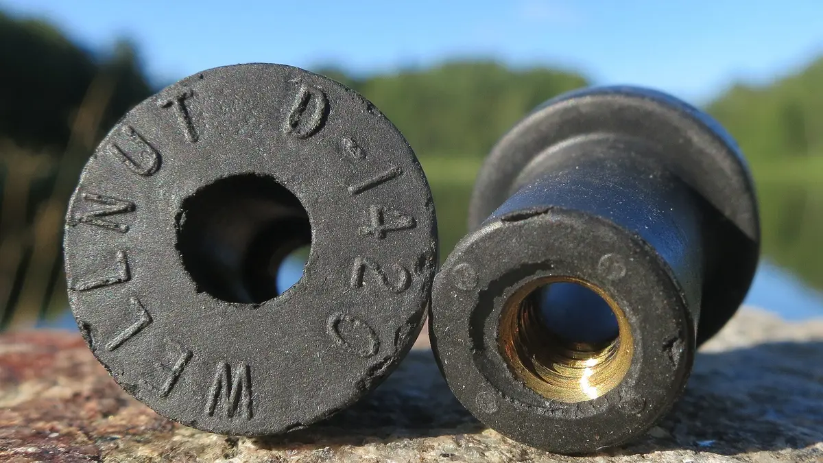 Insert-molded component with molded-in metal features