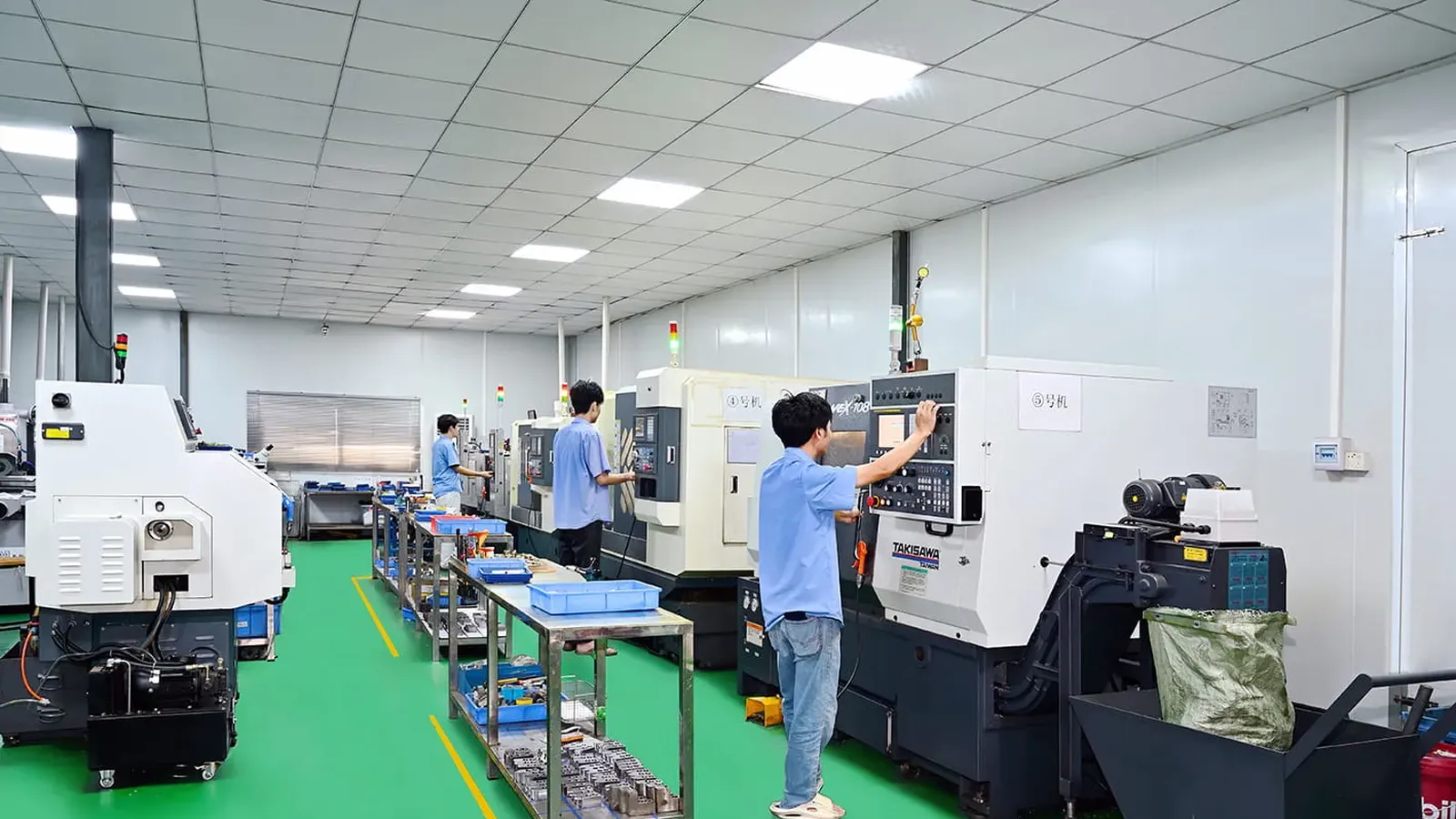 Turning workshop aisle with a line of CNC lathes